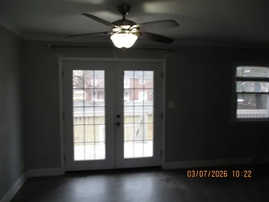 a view of an empty room with a window