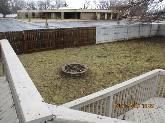 a view of a back yard from a balcony