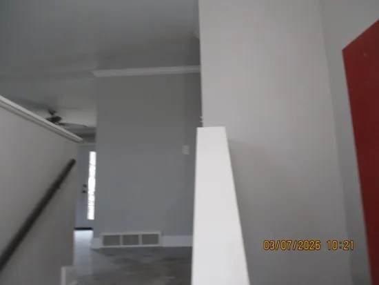 a view of a hallway with staircase