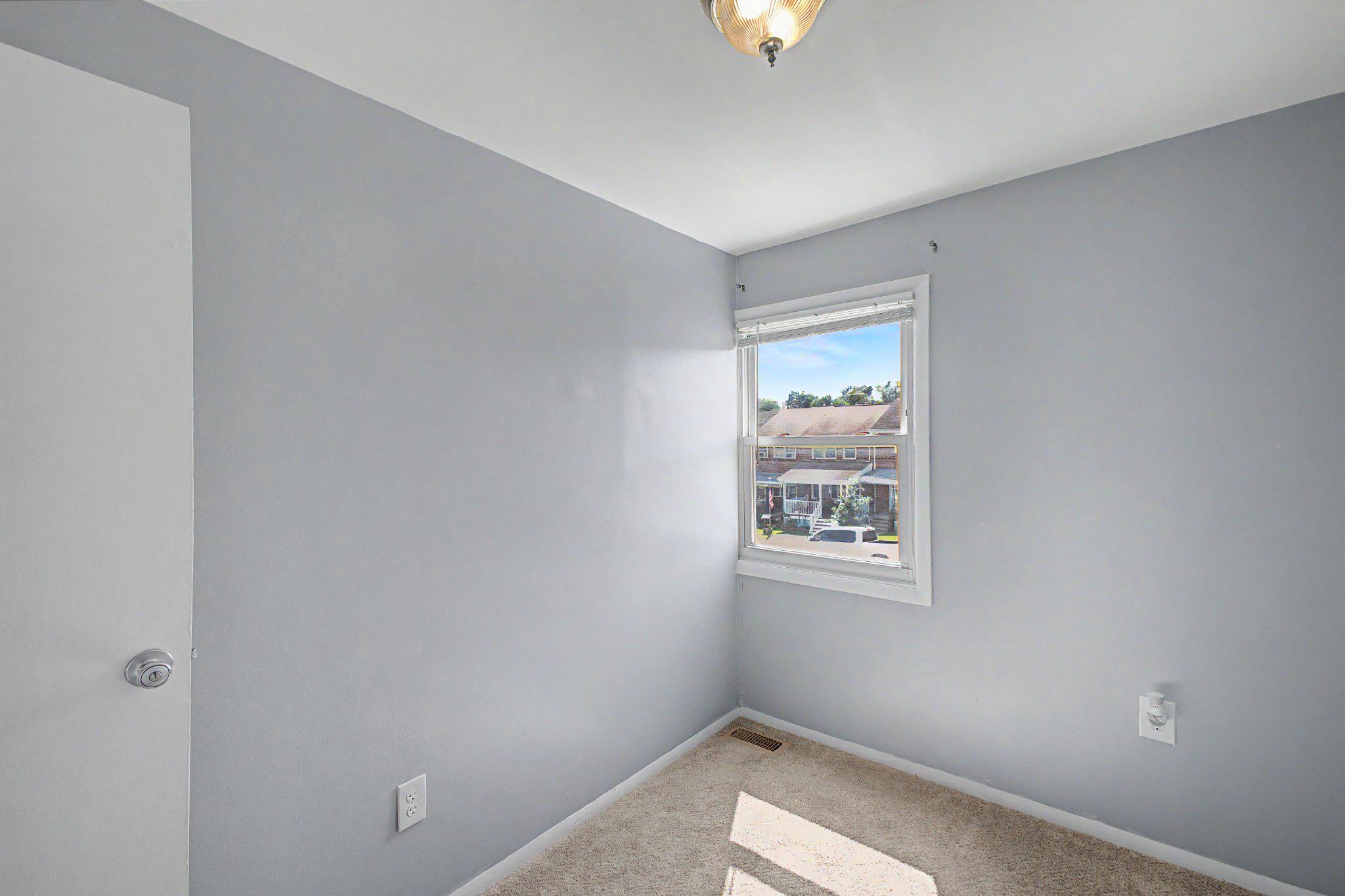 4447 Norfen Road Baltimore, MD 21227 - Photo 21 of 38 Bedroom with corner window.