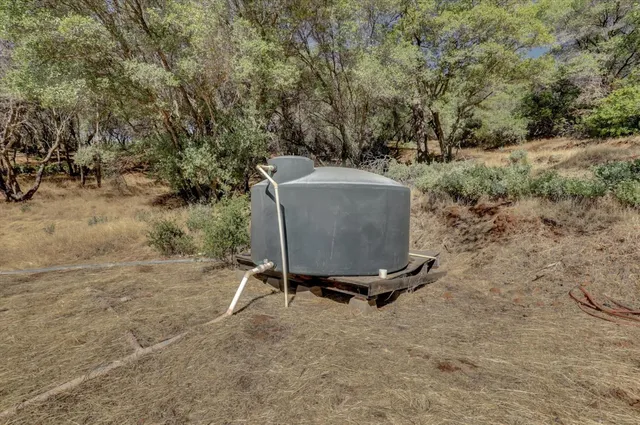a view of dirt yard and mountain view