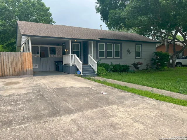 a front view of a house with garden and porch