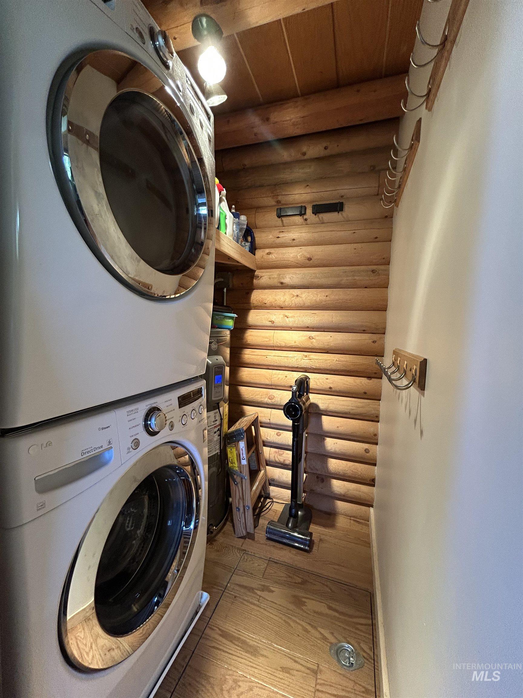 35 Sawtooth Way Stanley, ID 83278 - Photo 24 of 36 Laundry alcove featuring wood-finish flooring and log-style wall paneling