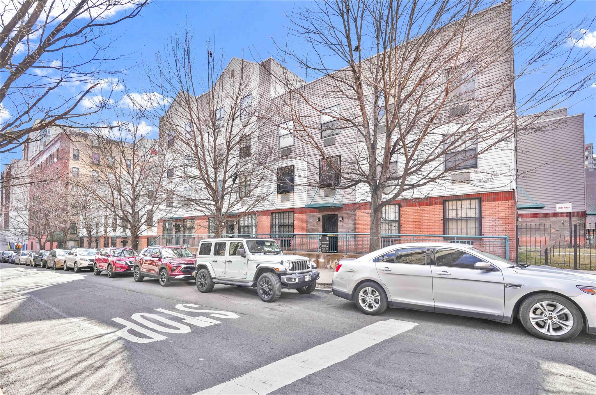 514 East 159th Street, Unit A Bronx, NY 10451 - Photo 1 of 5 a view of a city street with a car park
