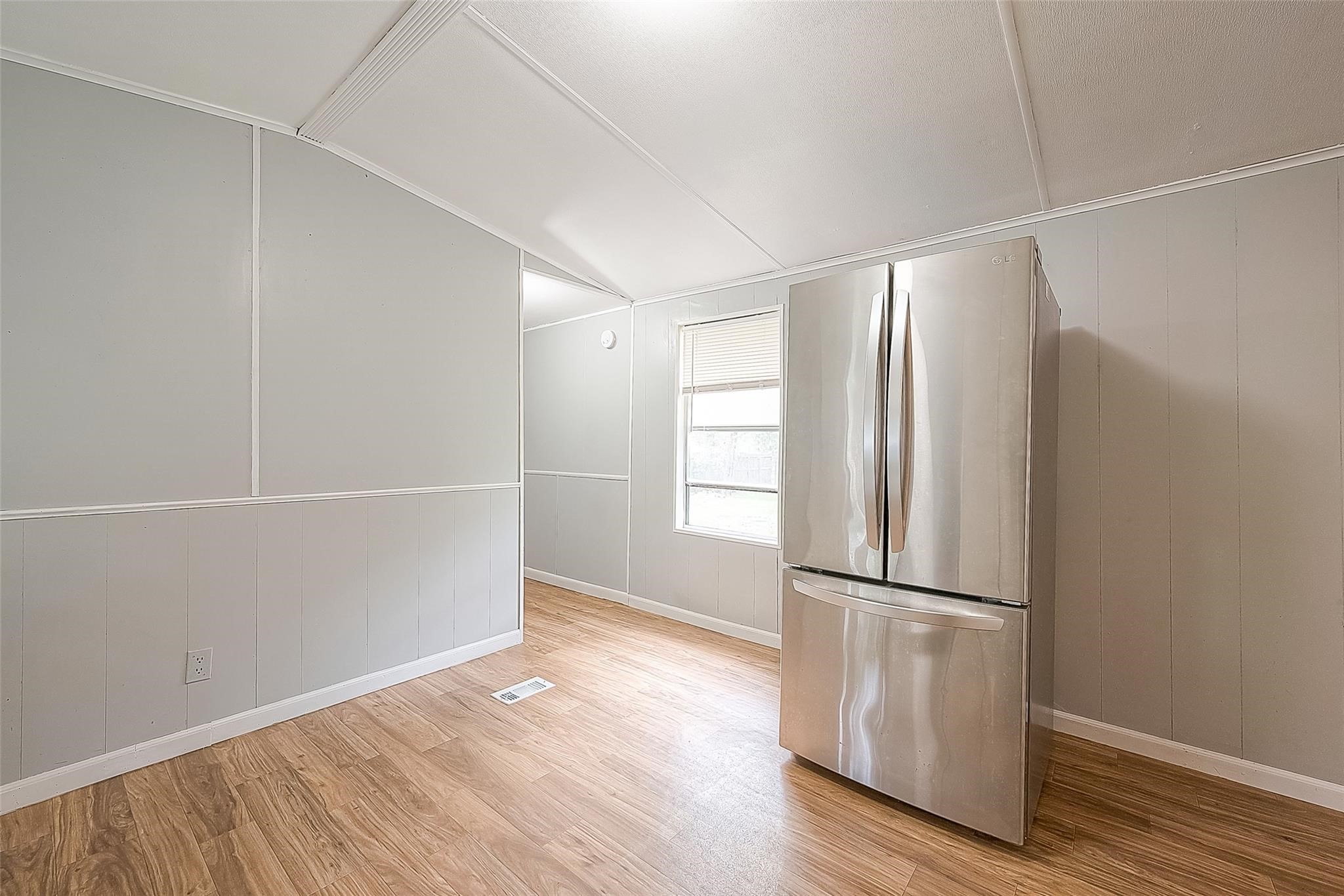17536 White Oak Orchard Conroe, TX 77306 - Photo 15 of 24 a view of empty room with wooden floor