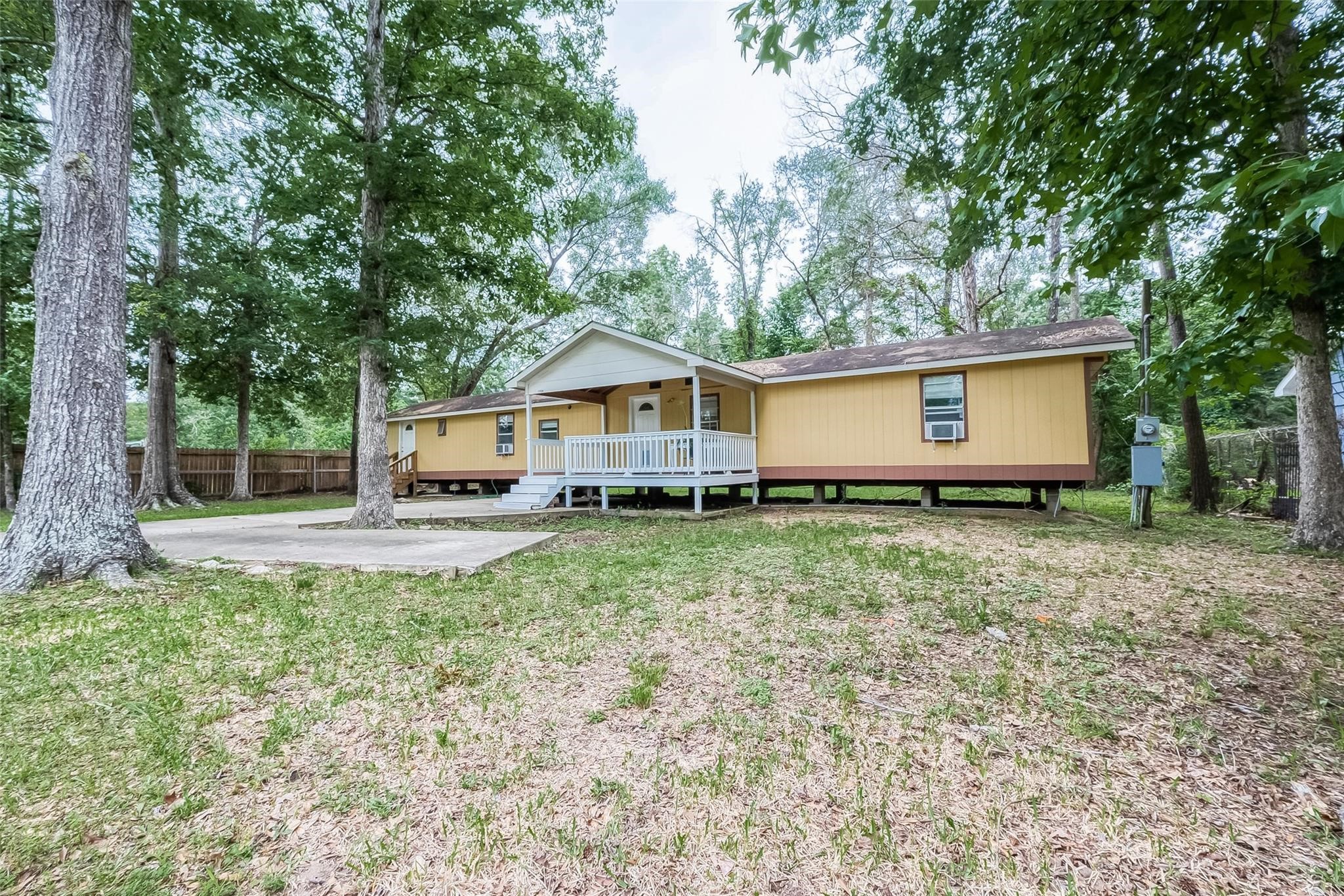 17536 White Oak Orchard Conroe, TX 77306 - Photo 2 of 24 a house view with a garden space