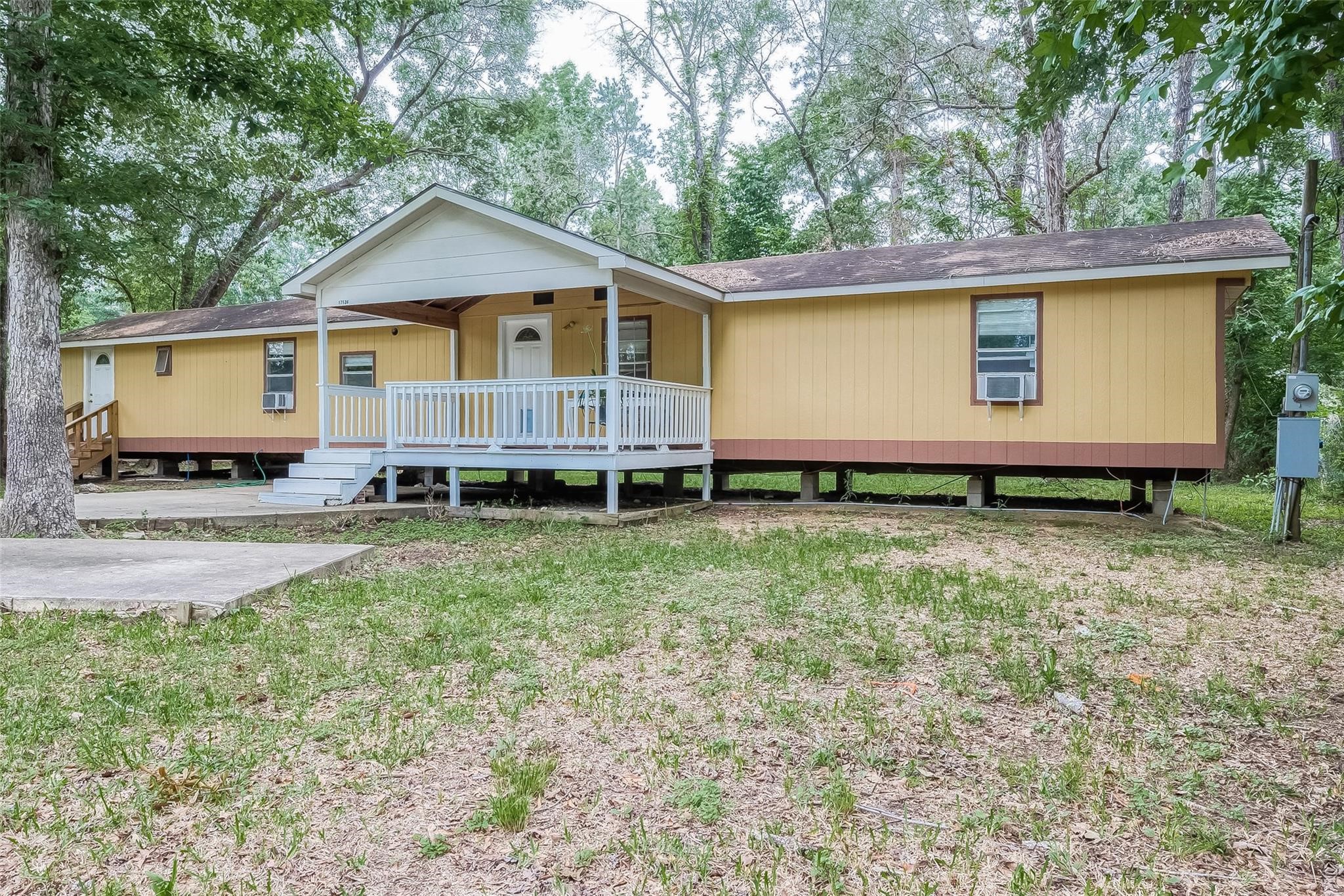 17536 White Oak Orchard Conroe, TX 77306 - Photo 3 of 24 a view of a house with yard and a tree