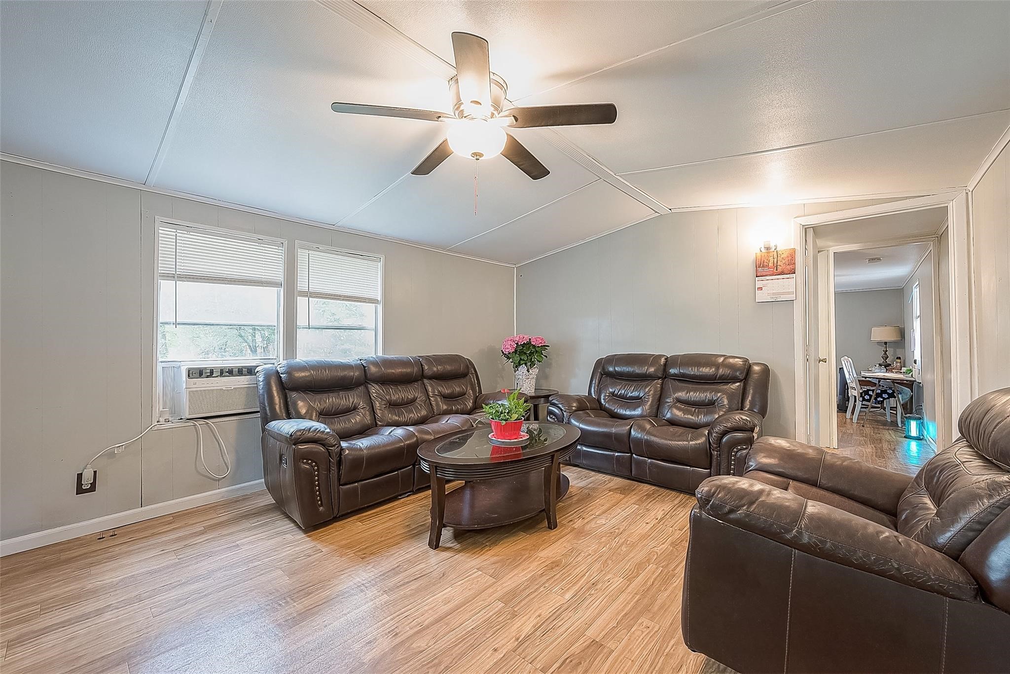 17536 White Oak Orchard Conroe, TX 77306 - Photo 6 of 24 a living room with furniture a flat screen tv and a window