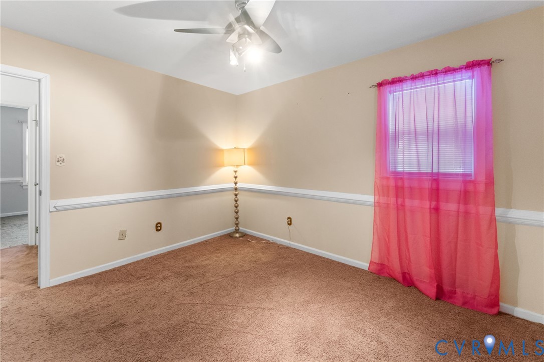 1760 Gloucester Road Gloucester Point, VA 23062 - Photo 31 of 47 Carpeted room featuring a ceiling fan with integra