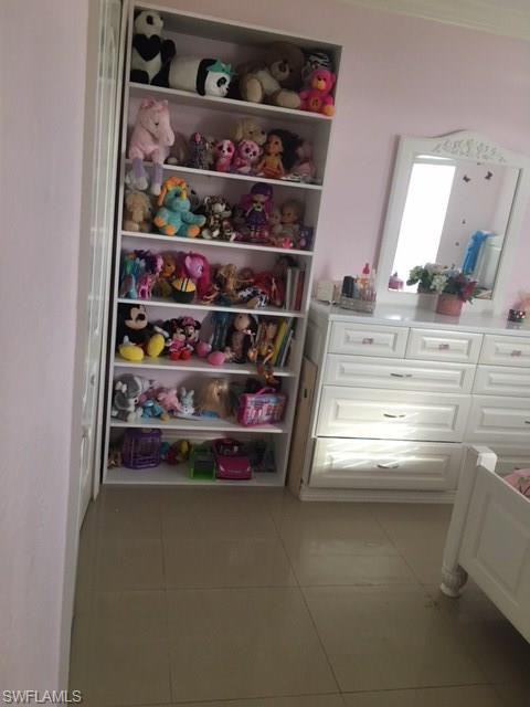 3906 14th Street Southwest Lehigh Acres, FL 33976 - Photo 11 of 25 a room with storage and utility
