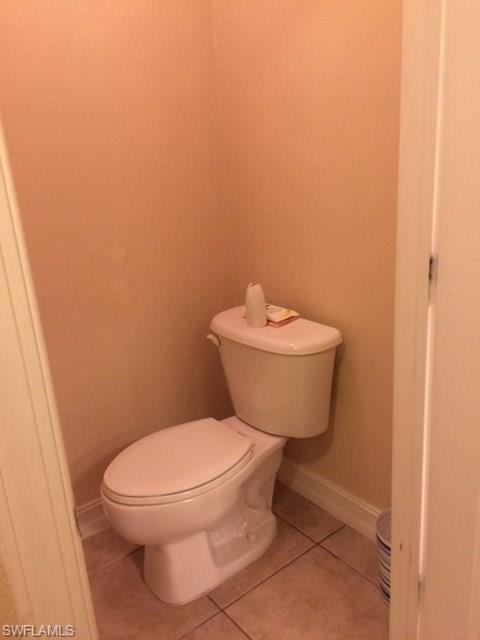 3906 14th Street Southwest Lehigh Acres, FL 33976 - Photo 13 of 25 a white toilet sitting next to a white sink