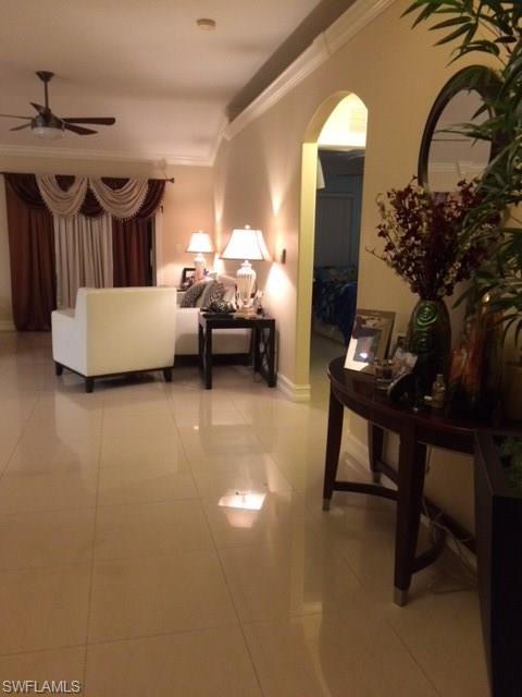3906 14th Street Southwest Lehigh Acres, FL 33976 - Photo 2 of 25 a living room with furniture and a potted plant