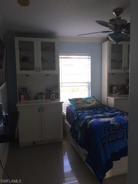 3906 14th Street Southwest Lehigh Acres, FL 33976 - Photo 24 of 25 a bedroom with a bed and a window