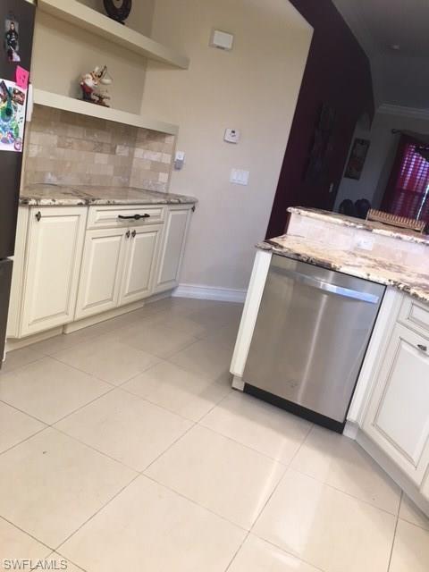 3906 14th Street Southwest Lehigh Acres, FL 33976 - Photo 5 of 25 a view of washer and dryer