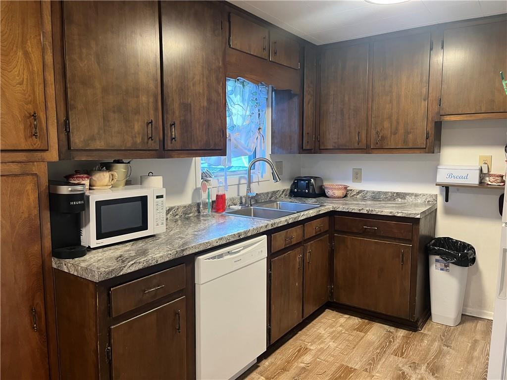902 Chestnut Avenue Northern Cambria, PA 15714 - Photo 6 of 10 a kitchen with granite countertop cabinets a sink and a stove