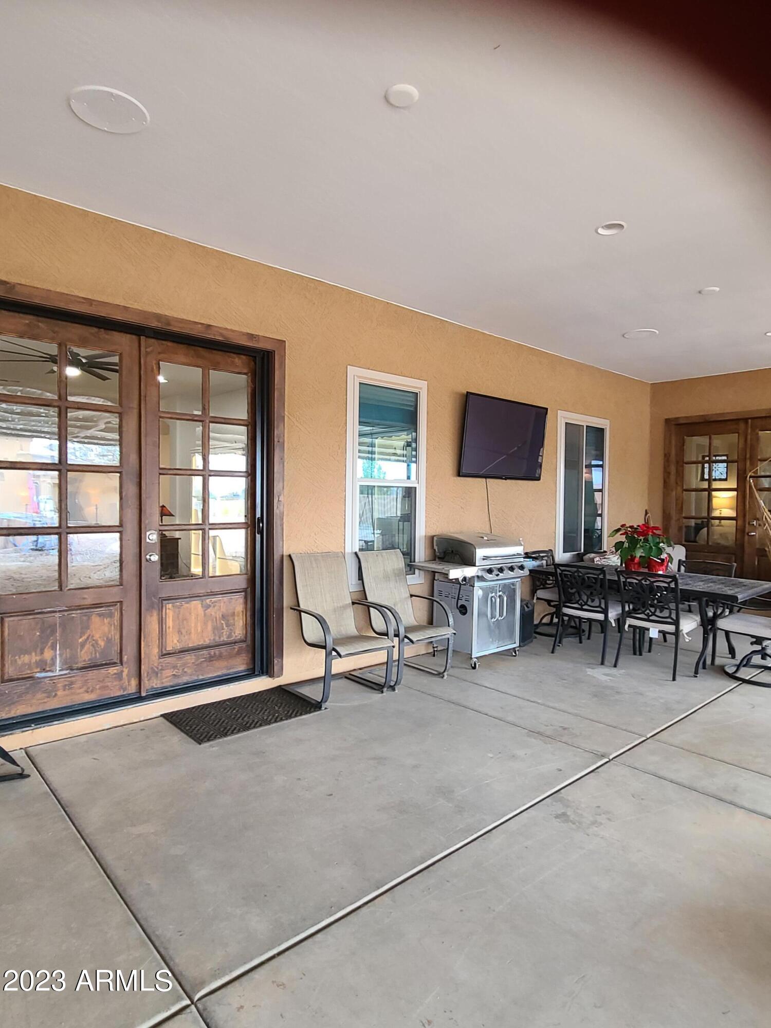 6806 North Citrus Road Waddell, AZ 85355 - Photo 111 of 124 Back patio showing french doors