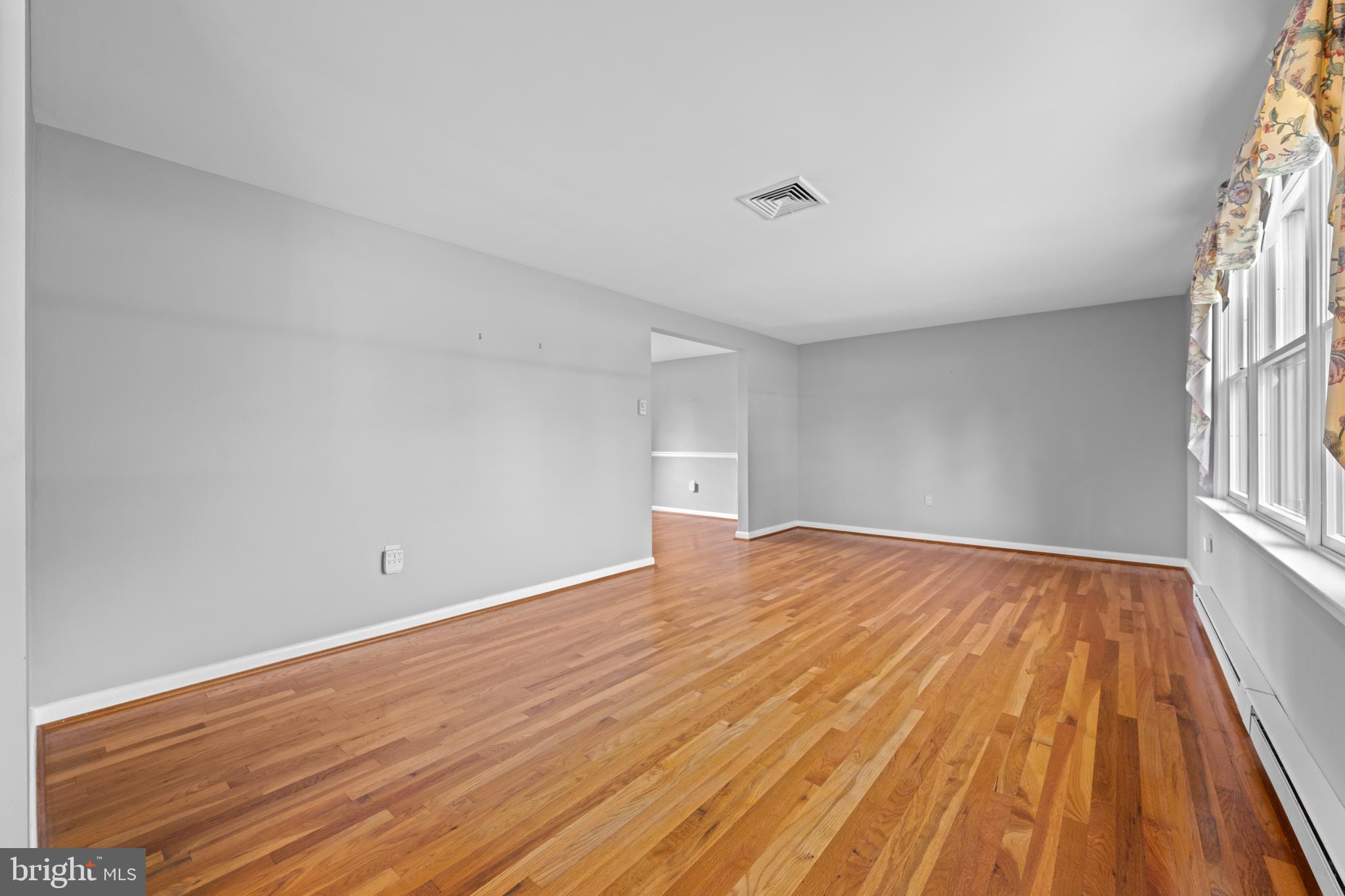 258 Monacy Road Coatesville, PA 19320 - Photo 27 of 54 a view of empty room with wooden floor and fan