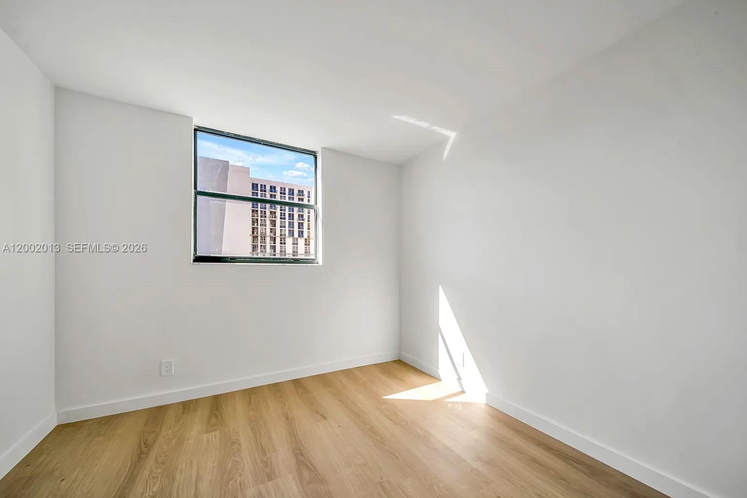 501 Southwest 1st Street, Unit 502 Miami, FL 33130 - Photo 20 of 24 an empty room with a window