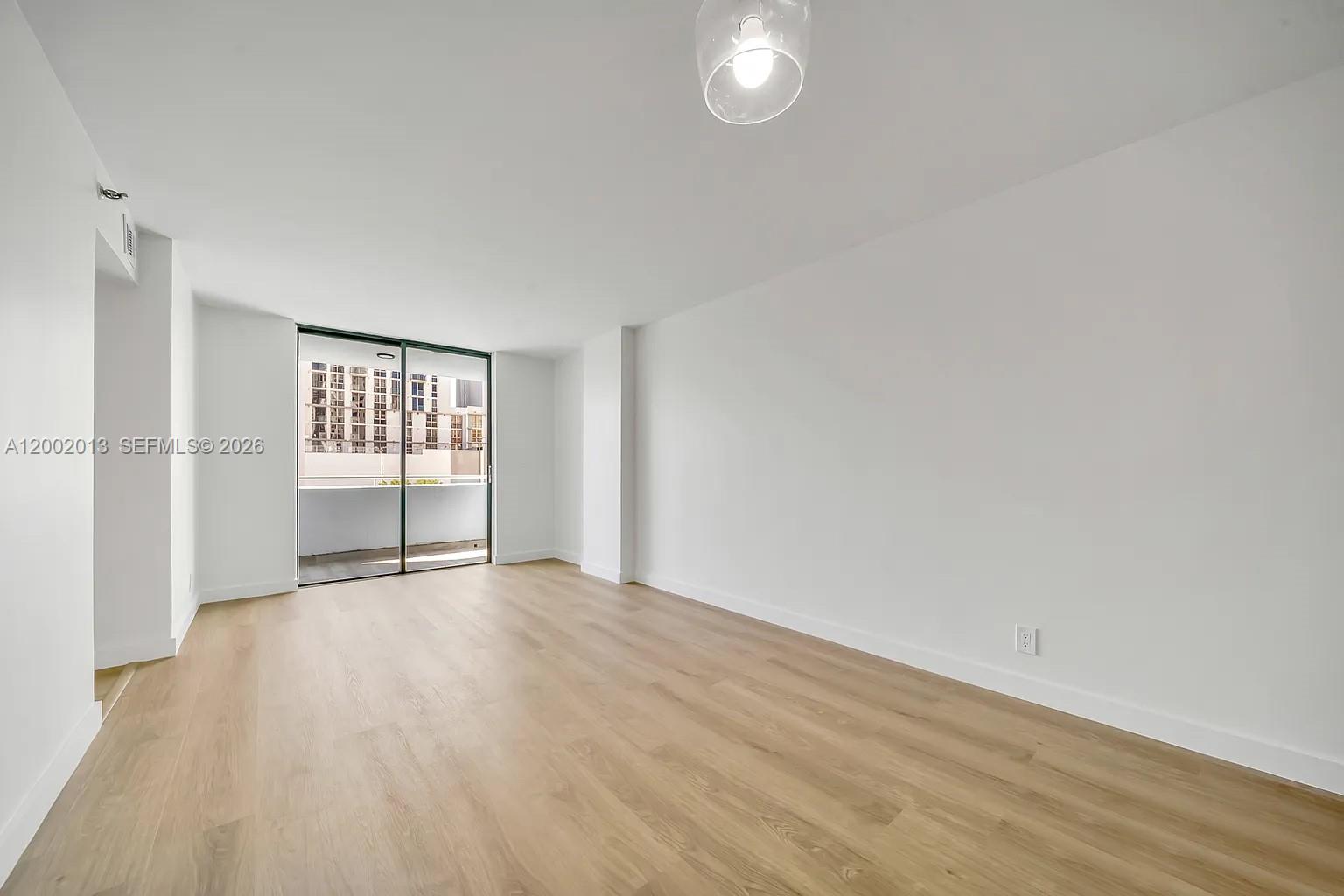 501 Southwest 1st Street, Unit 502 Miami, FL 33130 - Photo 3 of 24 a view of an empty room with a window