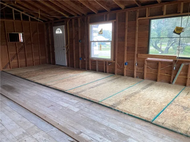 a bedroom with furniture and a window