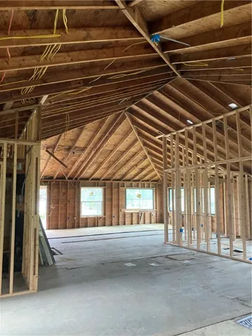 a view of an empty room with a fireplace