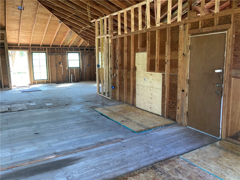 127 Lake Street Mathis, TX 78368 - Photo 21 of 33 an empty room with wooden floor and windows