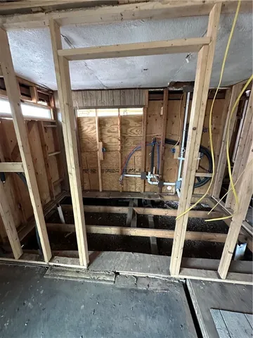 a view of an empty room with windows