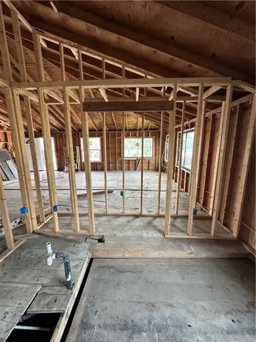 a view of dirt yard with a tree