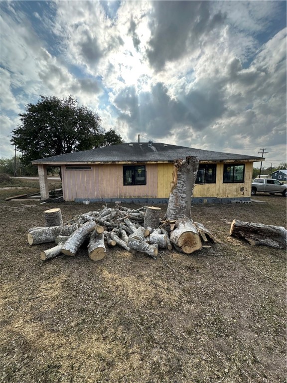 127 Lake Street Mathis, TX 78368 - Photo 9 of 33 a view of a backyard with table and chairs