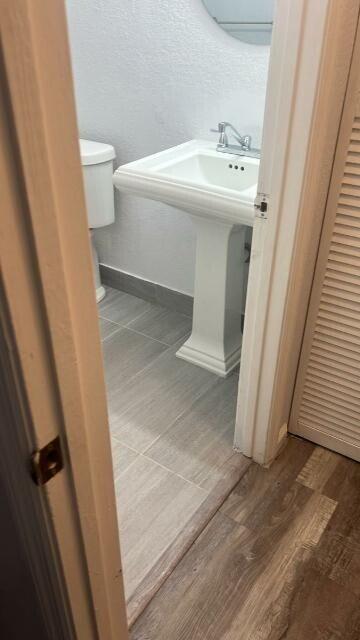 14040 Northeast 2nd Avenue Miami, FL 33161 - Photo 2 of 16 a bathroom with a sink and a mirror