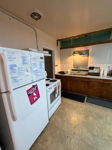a kitchen with stainless steel appliances a sink and a stove