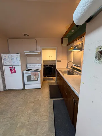 a utility room with washer and dryer