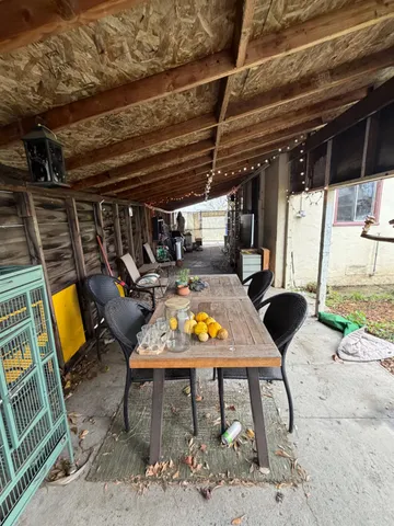 a view of a chairs and table in the patio