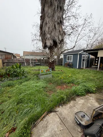 a backyard of a house with lots of green space