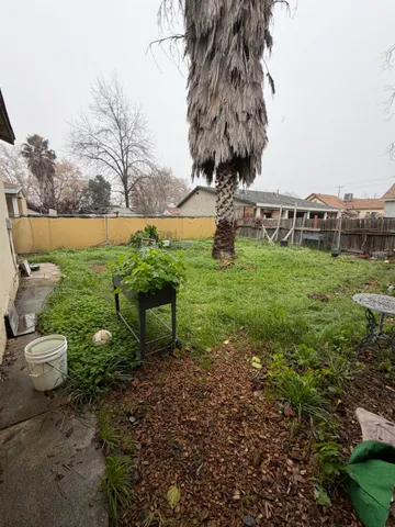 a backyard of a house with lots of green space