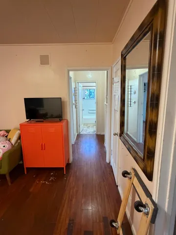 a view of room with wooden floor