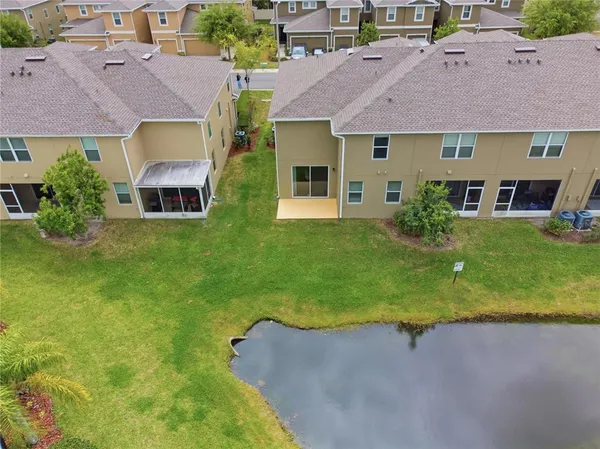 a kitchen with stainless steel appliances granite countertop a refrigerator and a stove