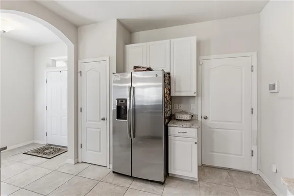 a kitchen with stainless steel appliances granite countertop a sink and a counter space