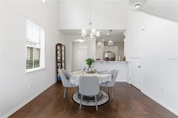 a kitchen with stainless steel appliances granite countertop a sink a stove top oven a counter space and cabinets