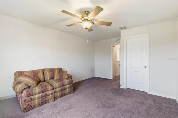 a bathroom with a sink a toilet a tub and shower