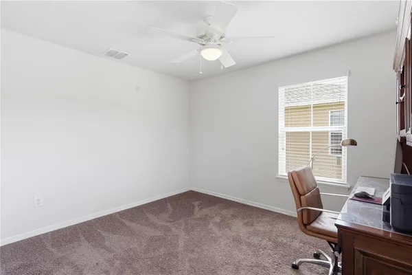 a workspace with furniture and window