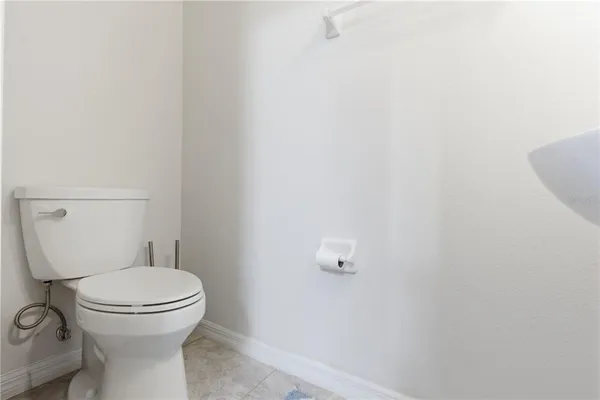 a view of walk in closet with clothes