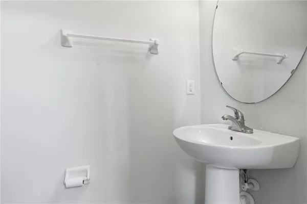 a bathroom with a glass shower door