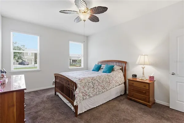 a living room with furniture wooden floor and a table