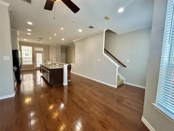 a view of kitchen with cabinets and wooden floor