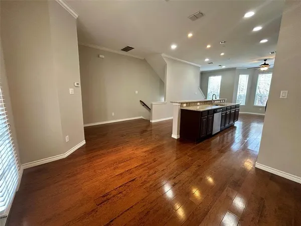 a living room with hard wood floors and a hard wood floor