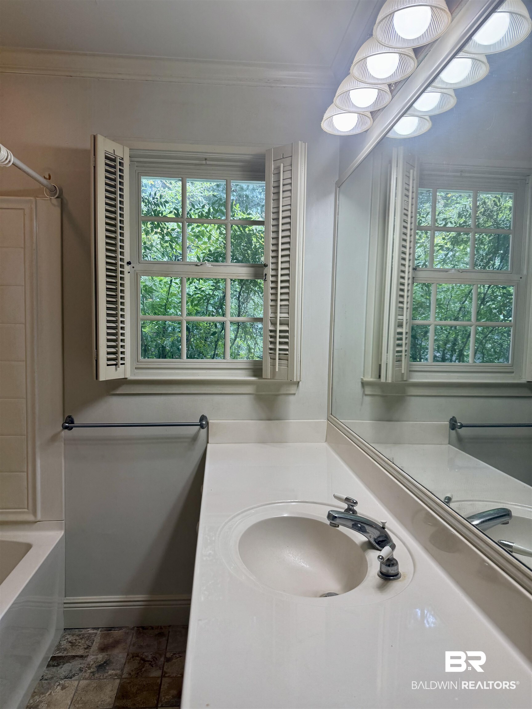 1412 Poplar Avenue Brewton, AL 36426 - Photo 18 of 32 Full bathroom featuring vanity, crown molding, tub / shower combination, and baseboards