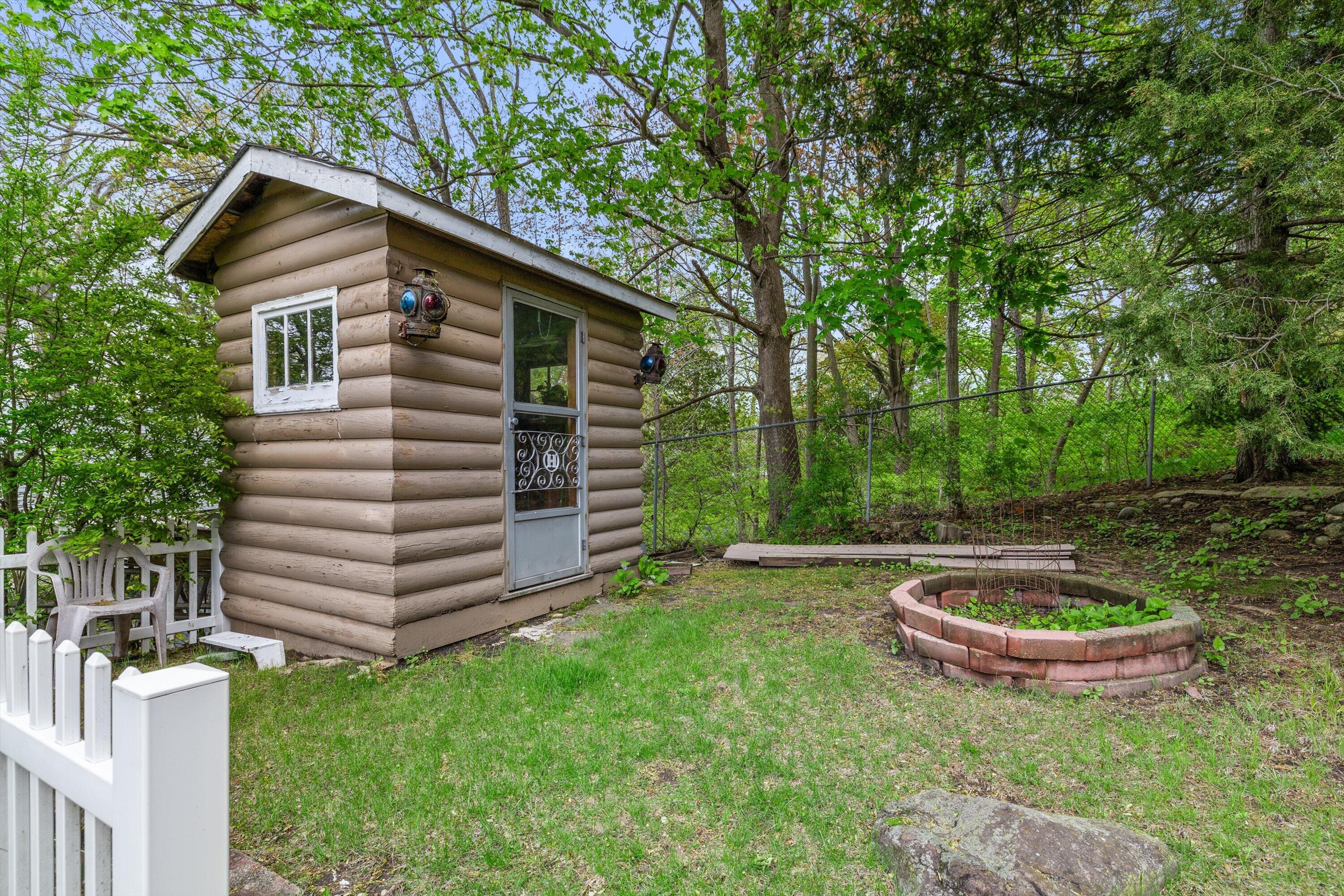 408 Valley Road Twin Lakes, WI 53181 - Photo 30 of 48 Backyard shed and fire pit