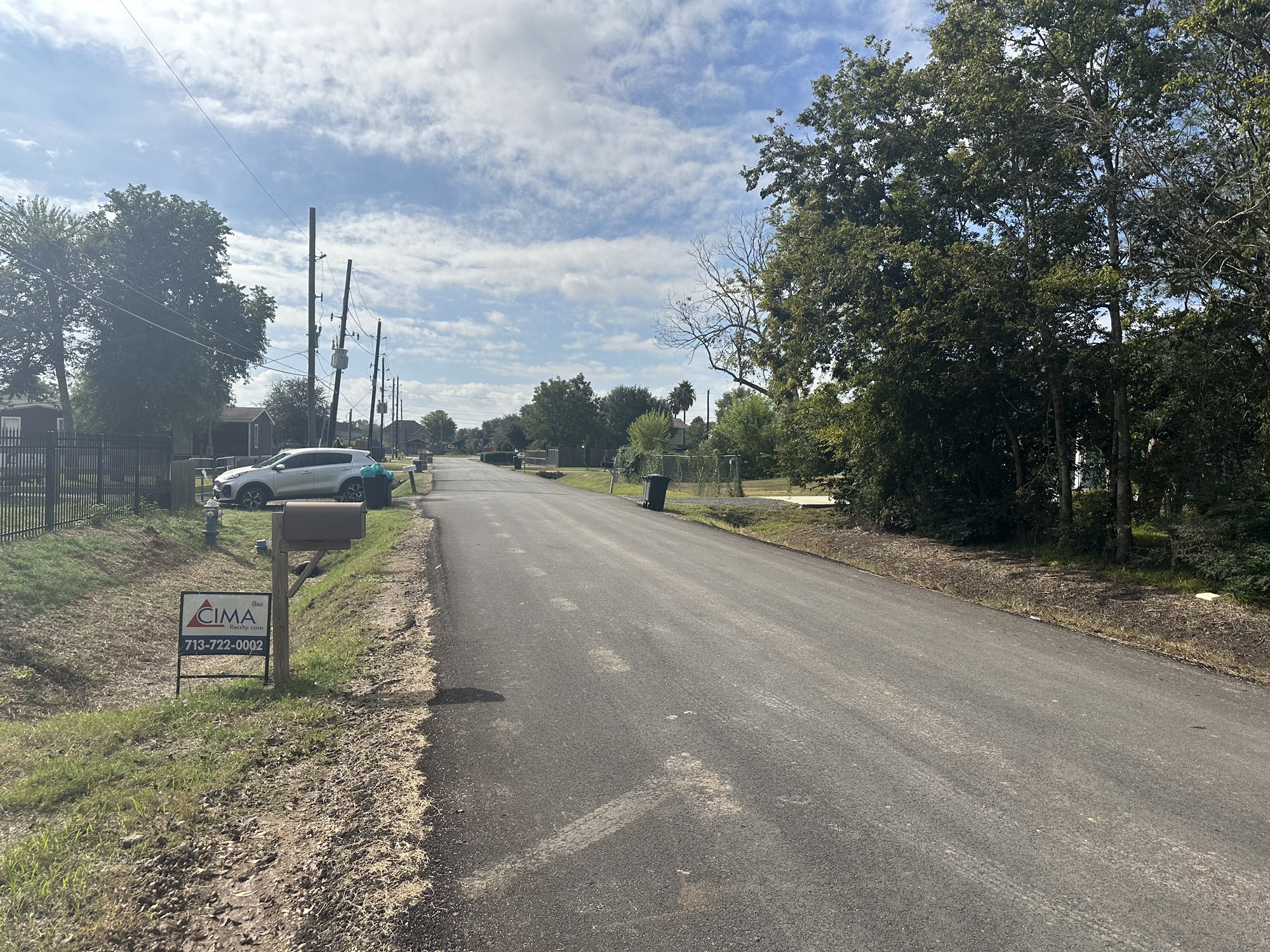 3315 Indiana Street Fresno, TX 77545 - Photo 6 of 6 a view of a street with a bench in the background