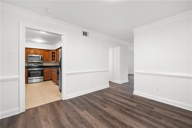 an empty room with wooden floor